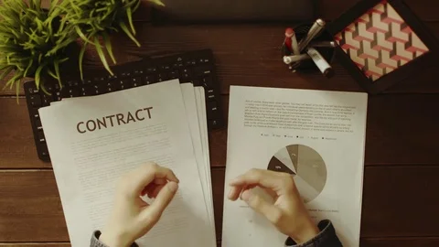 Overhead view of man having videochat and looking on diagrams and graphs Stock Footage 81183910