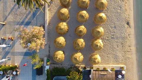 Overhead view of man jogging at seaside tourist resort of Pollenca, Mallorca Stock Footage 101018420