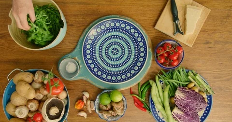 Overhead View Of Man Making Rocket And Parmesan Salad In Plate 4K Stock Footage 92101102