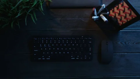 Overhead view of man playing on computer by using gamepad Stock Footage 81184322