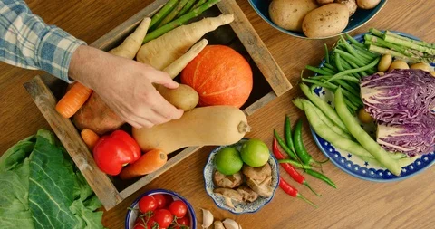 Overhead View Of Man Putting Fresh Vegetables In Wooden Crate 4K Stock Footage 92378288