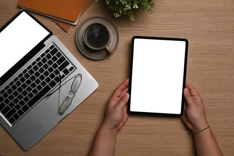 Overhead view man using digital tablet at workplace. Stock Photos