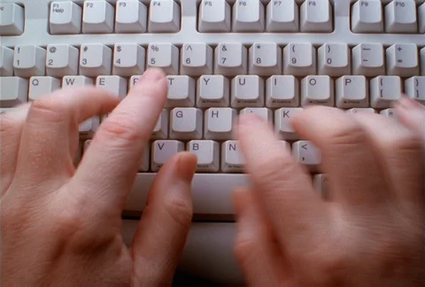 Overhead view of man's hands typing on computer keyboard Stock Footage 86882764