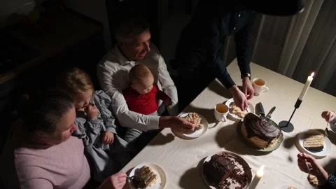 Overhead view of a multigenerational family gathered around a dining table Stock Footage 340064341