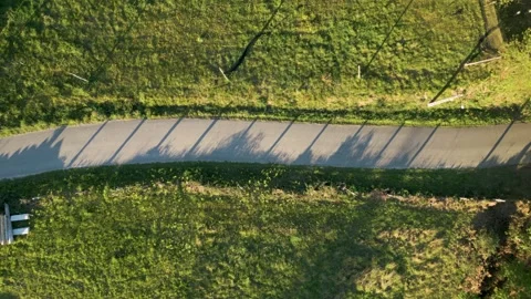 Overhead View Of Narrow Road Between The Green Meadow In Summer Stock Footage 246745200
