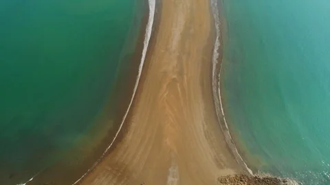 Overhead view of narrow sandbar between two ocean currents in Costa Rica Stock Footage 345687793