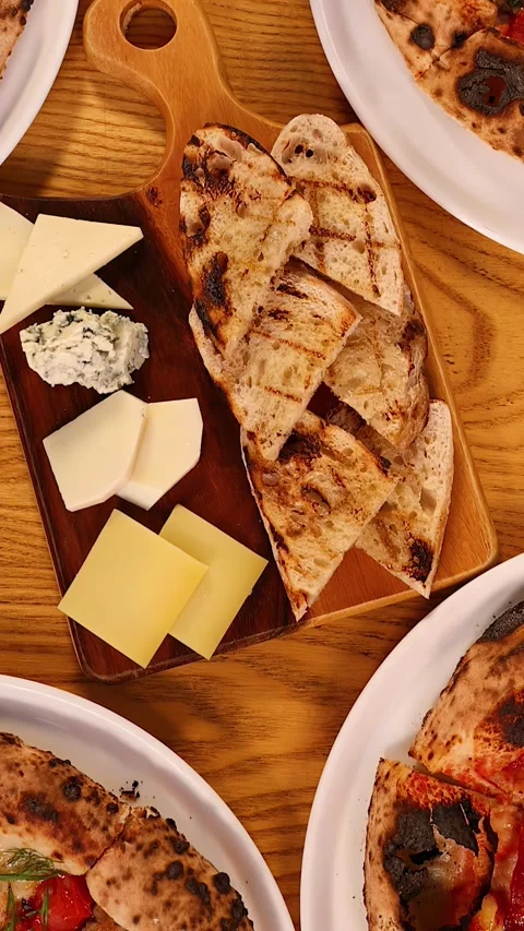 Overhead View of Neapolitan Pizza and Italian Antipasto Platter 스톡 동영상 339422319
