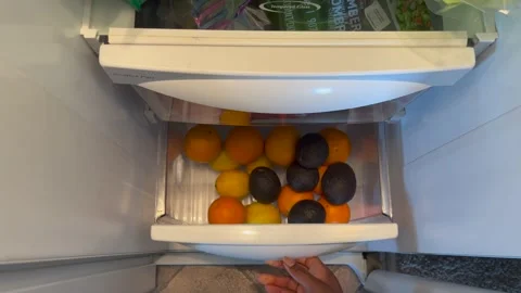 Overhead view of opening a fridge drawer Stock-Footage 211786067