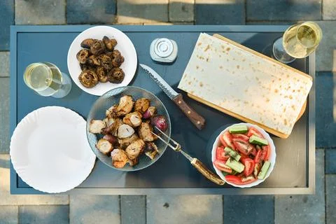 Overhead view of patio table served for picnic Stock Photos