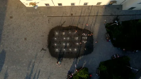 Overhead view people having fun at city square fountain Stock Footage 172198853