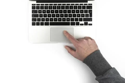 Overhead view of person using touchpad or trackpad on laptop computer on white Stock Photos