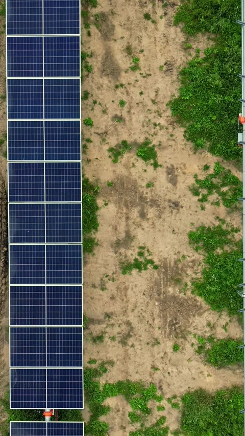Overhead View of Photovoltaic Array on Sparse Ground Stock Footage 337137917