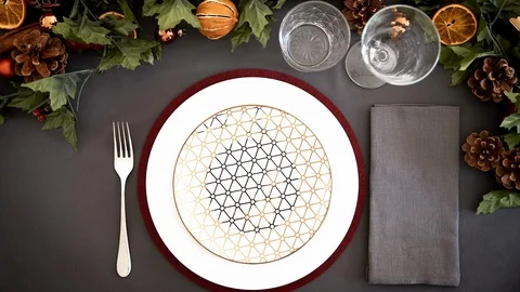 Overhead view of a place setting at a Christmas dinner table with Christmas Stock Footage 99773684