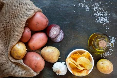 Overhead view of Potatoes on slate table Stock Photos