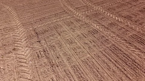 Overhead view of a prepared seedbed on arable land. Drone video showing Stock Footage 336001905