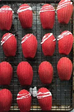 Overhead view of red madeleines cake or cookies on baking rack 스톡 사진