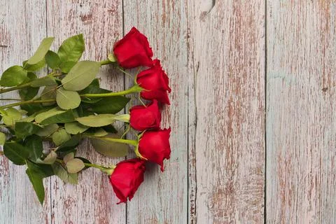 Overhead View of Red Roses on Rustic Wood Table Stock Photos