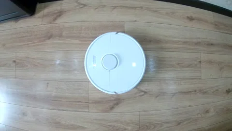 Overhead view of robot vacuum cleaner Stock Footage 220254823