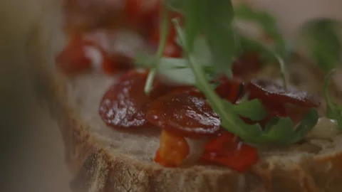 Overhead view of rocket leaves being put onto sandwich Stock Footage 194478484