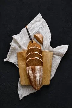 Overhead view of rue bread on dark background Foto stock
