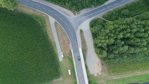 Overhead view of a rural road junction with passing cars in Germany 스톡 동영상 340159344