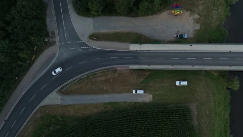 Overhead view of a rural road junction and bridge with passing cars 스톡 동영상 340159522