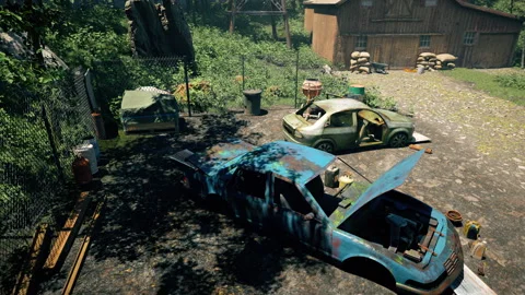 An overhead view of a rural yard with two stripped-down cars Stock Footage 309072348