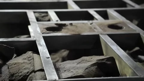 Overhead view of a sand casting mold flask grid filled with cores in a foundry Stock Footage 343370183