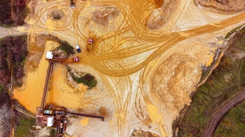 Overhead view of sand quarry with mining trucks, Bulgaria Stock Footage 341761014