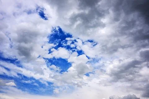 Overhead view of scattered clouds over blue sky Photos