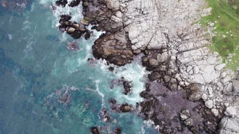 Overhead View Of Sea Waves Crashing Against Rocks Along Isla Negra Coast, Chile Stock Footage 344686004
