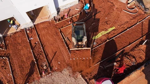 Overhead View Of Skid-Steer Loader Grading Red Dirt Within Wooden Forms At Stock Footage 337207300