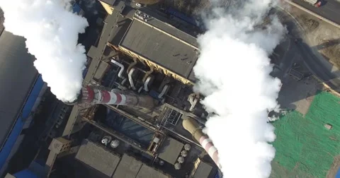 OVERHEAD VIEW OF SMOKE STACKS BURNING COAL AT INDUSTRIAL PLANT IN CHINA Stock Footage 61816127