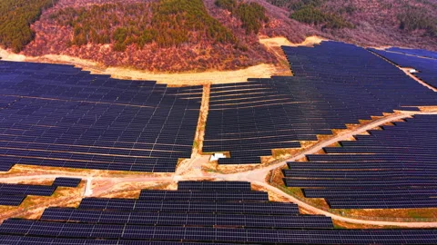 Overhead view of solar panel array on forested hillside, Bulgaria Stock Footage 336723801