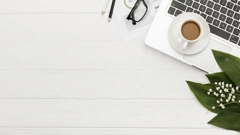 Overhead view spiral notepad laptop with coffee cup desk Stock Photos