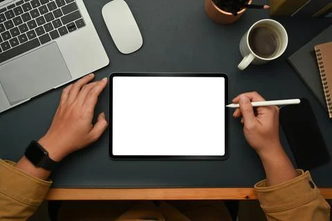 Overhead view of start up businessman using digital tablet on black leather Stock-Fotos