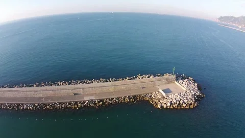 Overhead View of Stone Pier in Clear Sea Stock Footage 307909661