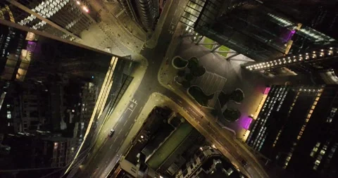 Overhead view of street between highrise building at night Stock Footage 201450098