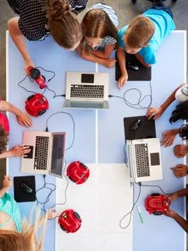 Overhead View Of Students In After School Computer Coding Class Learning To Stock Photos