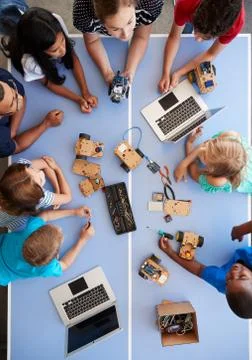 Overhead View Of Students In After School Computer Coding Class Learning To Stock Photos