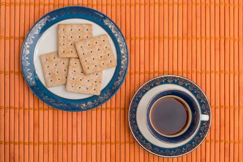 Overhead view of table with mat, coffee and cookies Stock Photos