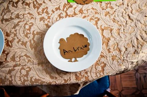 Overhead view of text on hen shape cardboard in plate on table Stock Photos