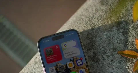Overhead View Through Foliage Of iPhone 14pro Resting On Stone Wall Video stock 235964086