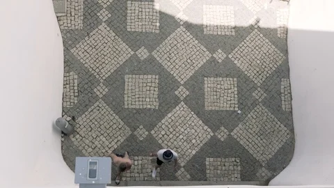 Overhead view of tourists walking into Albufeira beach tunnel Stock Footage 118355331