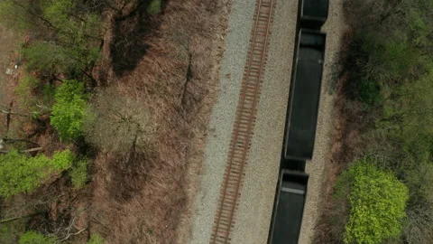 Overhead view of train going across tracks Stock Footage 152412560