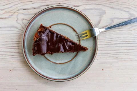 Overhead view of a triangular slice of homemade chocolate almond brownie se.. Stock Photos