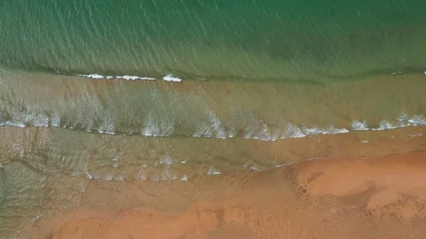 Overhead view of turquoise sea waves at sandy beach 스톡 동영상 149297404