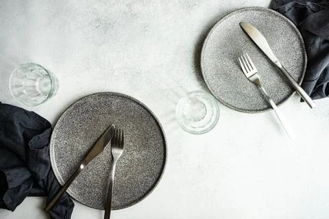 Overhead view of two minimalistic place settings on a  table Stock Photos