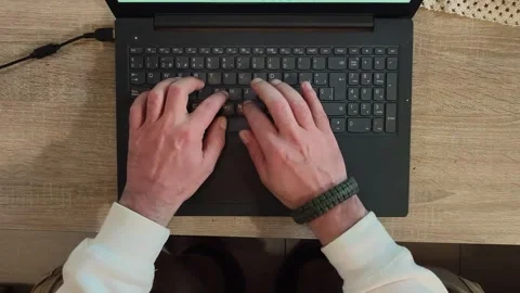 Overhead view typing on laptop keyboard – remote work and technology concept Video stock 330763049