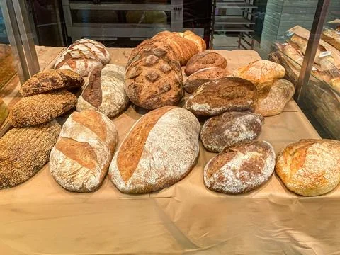 Overhead view of a vibrant bakery, showcasing various freshly baked breads .. Stock Photos